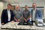 Montgomeryshire MP Craig Williams (left) and MS Russell George (right) with Joe Varley and his assistant Carl Williams in the new LochAnna kitchens showroom at the Varleys of Newtown on Saturday.